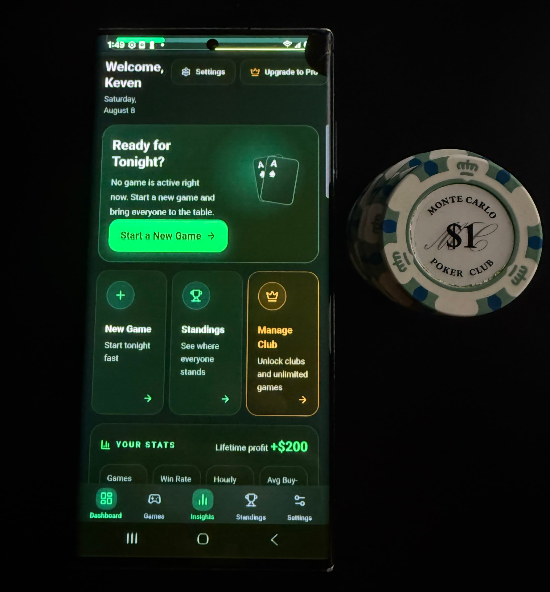 HG Poker running on an Android phone next to a poker chip